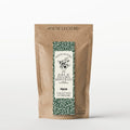 Thé vert et son marque-page "Alice au pays des merveilles" saveur fraise-rhubarbe - 80g